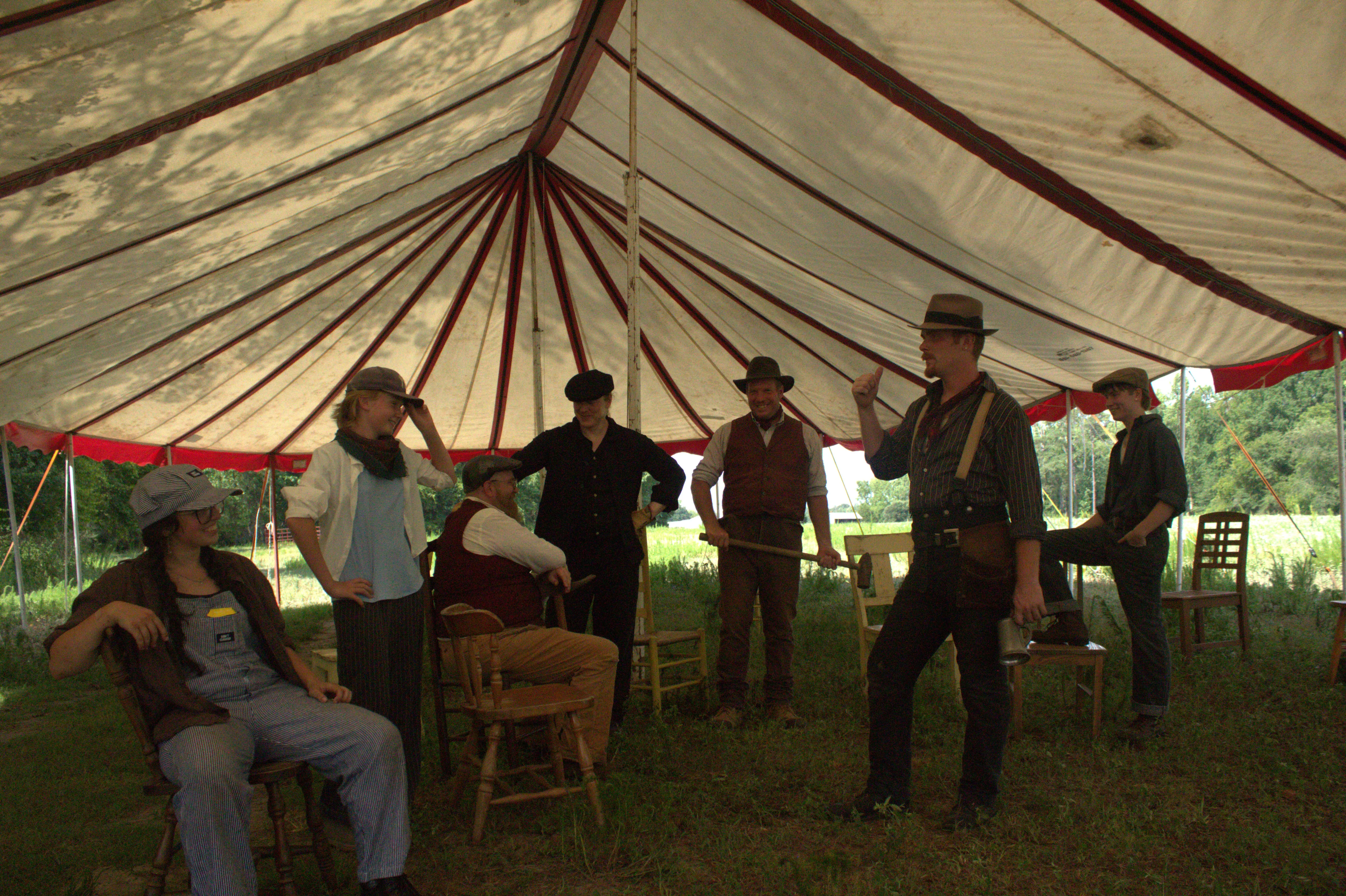 The full Kuroneko Circus company posed in front of their traveling tent in North Carolina